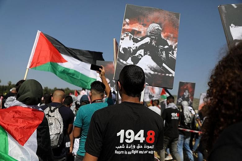 Israeli Arabs taking part in a rally calling for the right of return for refugees who fled their homes during the 1948 Arab-Israeli War, near Atlit, Israel, on April 19.