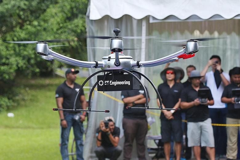 A drone demonstration by ST Aerospace during Car-Free Sunday SG at one-north yesterday, the first such event to be held outside the Civic District and Telok Ayer. Members of the public can submit feedback on the CAAS' proposed amendments until May 31