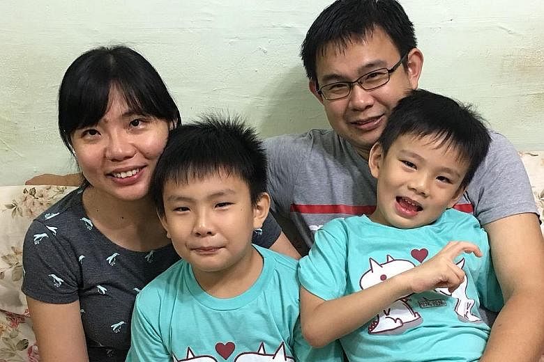 Finance manager Tony Lai, 39, with his wife Yvonne Chang, 35, and their sons Jordan (left), seven, and Lebron, six. The family signed up for the ST Run for the first time last year, and will be back this year.