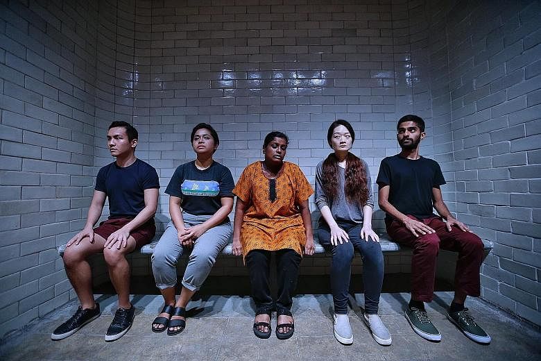 The cast of 0600, including (from far left) Jeramy Lim, Suhaili Safari, Grace Kalaiselvi, Lina Yu and Vignesh Singh, takes viewers on a journey tracing the prisoners' route through the former Supreme Court building.