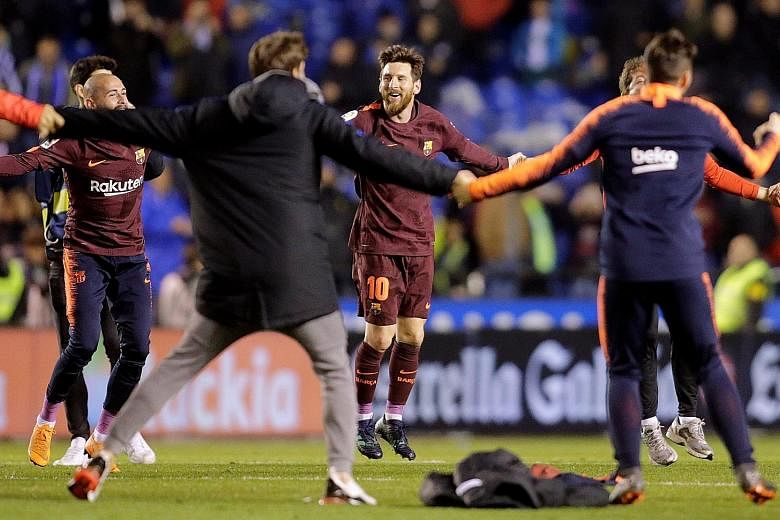 Lionel Messi celebrating Barcelona's LaLiga title win with his team-mates after they won 4-2 at Deportivo La Coruna on Sunday. Barcelona are four games away from finishing the season unbeaten in the league.