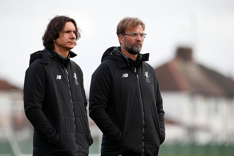 Liverpool manager Jurgen Klopp (right) and assistant manager Zeljko Buvac at the Premier League club's Melwood training ground last month.