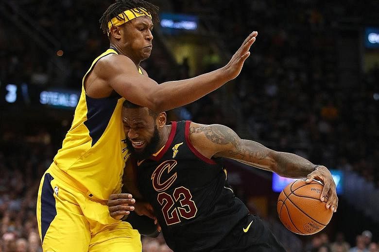 Cavaliers star LeBron James trying to drive around Pacers centre Myles Turner during the second half in Game 7 of the NBA Eastern Conference quarter-finals at Quicken Loans Arena on Sunday. James finished with 45 points.