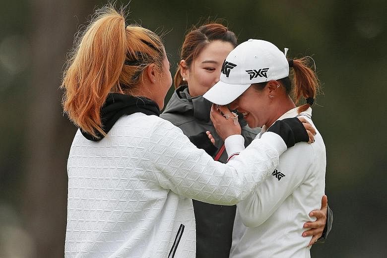 An emotional Lydia Ko being hugged by friends after beating Australia's Minjee Lee in a play-off to win the Mediheal Championship at Lake Merced Golf Club in Daly City, California on Sunday.