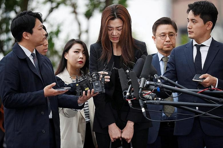 Ms Cho Hyun Min yesterday apologised repeatedly at her first appearance since allegations that she threw a drink at people during a business meeting last month.