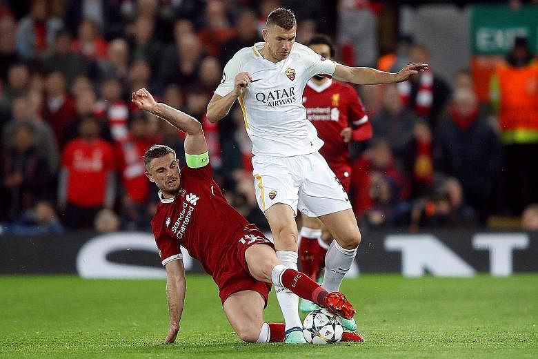 Roma's Edin Dzeko being tackled by Liverpool's Jordan Henderson in their Champions League semi-final first leg at Anfield, which the Reds won 5-2. The five-time European champions have never given up a first-leg advantage of three goals or more in Eu