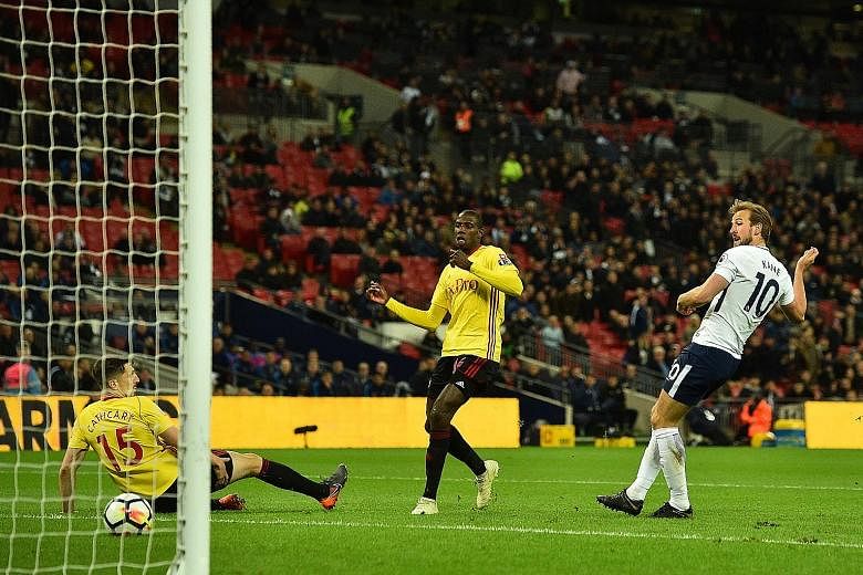 Tottenham striker Harry Kane scores his side's second goal in the 2-0 Premier League win over Watford at Wembley on Monday. He now has 27 league goals, four fewer than Mohamed Salah.