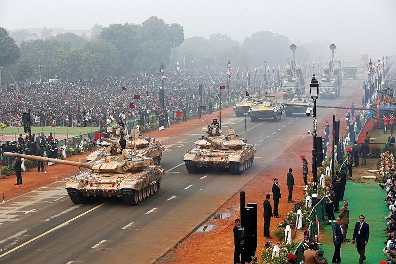 Indian Army combat vehicles during a parade marking Republic Day in New Delhi in January. India's defence spending rose by 5.5 per cent to US$63.9 billion (S$85.3 billion) in 2017 and has now passed France, the Stockholm International Peace Research 