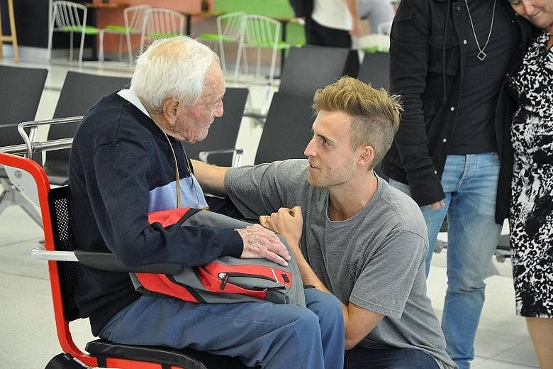 Dr David Goodall being seen off by his grandson at Perth Airport on Wednesday. The scientist, who has no terminal illness, was forced to work closer to home and to give up driving.