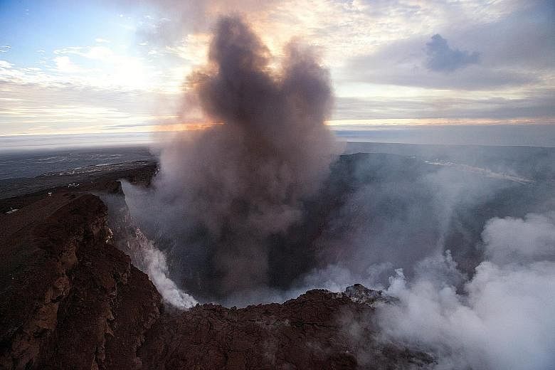 Smoke rising from the crater of Pu'u 'O'o, a volcanic cone in the eastern rift zone of the Kilauea Volcano in Hawaii, on Wednesday. The crater's floor collapsed on Tuesday and since then it has kept eroding its walls and generating huge explosions of