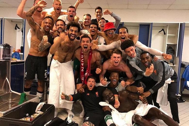 Liverpool players celebrating in the dressing room at the Stadio Olimpico in Rome on Wednesday after reaching the final of the Champions League with a 7-6 aggregate win over Roma. The Reds are chasing their sixth victory in Europe's elite club compet
