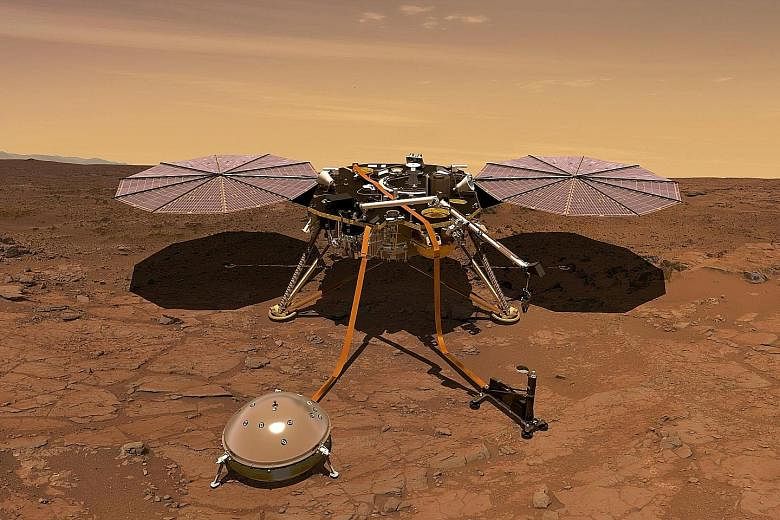 An artist's rendition of Nasa's InSight probe operating on the surface of Mars. The unmanned spacecraft is due to lift off from Vandenberg Air Force Base in California today and should land on the Red Planet on Nov 26.
