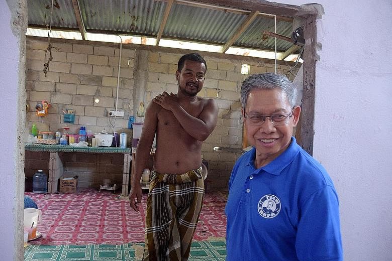 International Trade and Industry Minister Mustapa Mohamed, who is also Umno chief for Kelantan state, visiting a constituent in the rural seat of Jeli. He is optimistic that BN can recapture Kelantan from PAS.