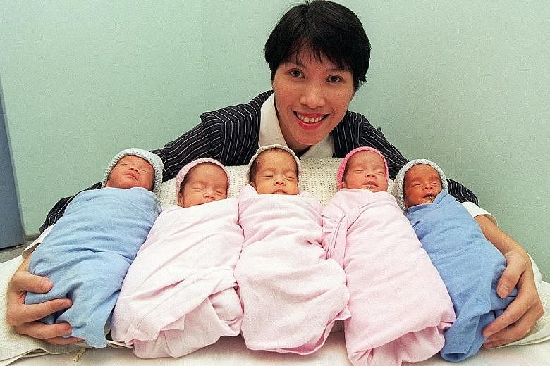 Above: Mrs Dorothy Chin with her brood of five - (from left) Adriel, Alicia, Amanda, Annabelle and Andre - who were born in that order on April Fool's Day in 1997. The two boys and three girls were the first set of quintuplets to be born in Singapore