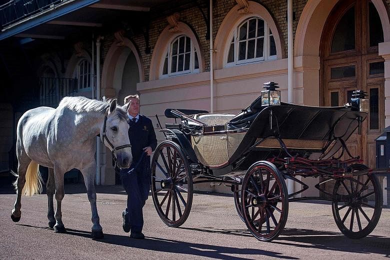 Prince Harry and Ms Meghan Markle will hold their wedding ceremony at St George's Chapel (above) on May 19. They will use the Ascot Landau carriage (left) for their procession through Windsor Town.