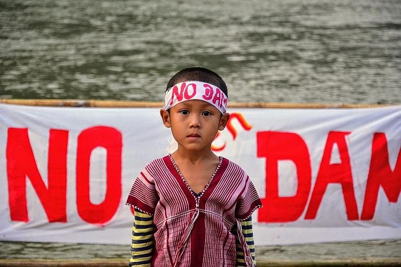 A child taking part in a protest against a massive hydropower dam being built in eastern Myanmar.