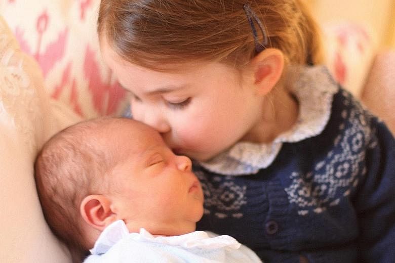 Princess Charlotte and her brother, Prince Louis, in a photograph taken by their mother, the Duchess of Cambridge, on Princess Charlotte's third birthday at Kensington Palace.
