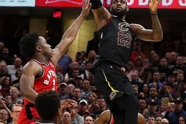 Cleveland Cavaliers star LeBron James hits the game-winning shot over the outstretched hand of O.G. Anunoby of the Toronto Raptors to give his team a 105-103 win in Game 3 and a 3-0 advantage in their Eastern Conference semi-finals series at Quicken 