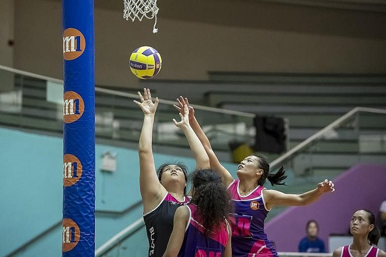 The Blaze Dolphins' Lee Pei Shan attempts a shot against the Sneakers Stingrays in the preliminary final yesterday. The Dolphins won 47-41 and will meet defending champions the Mission Mannas in the M1 Netball Super League grand final at the Toa Payo