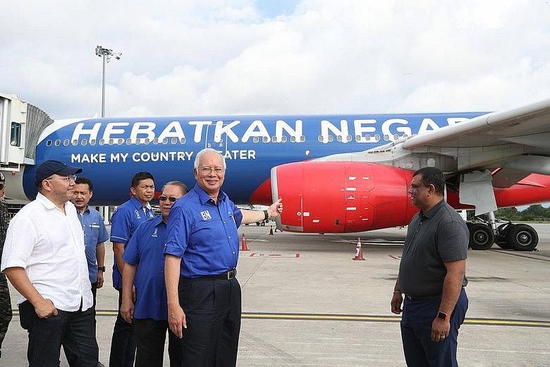 Tun Dr Mahathir Mohamad returned to Langkawi yesterday for his last push in the elections. He attended a community feast on the nearby islet of Tuba, where residents had fashioned a helicopter out of opposition party flags. When he was premier, they 