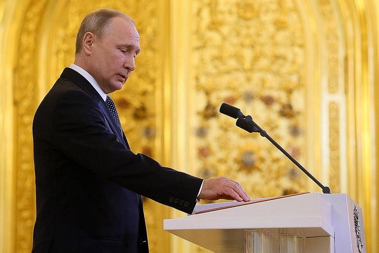 Mr Vladimir Putin taking the oath of office for the fourth time as Russian President in the Kremlin yesterday.