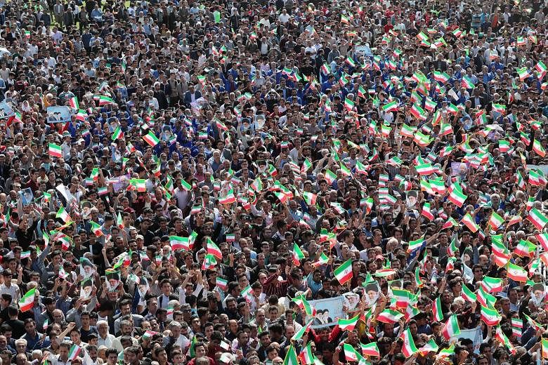 Crowds listening to Iranian President Hassan Rouhani in the city of Sabzevar, in north-western Iran, on Sunday. Mr Rouhani has said that Iran wants the JCPOA or nothing at all.