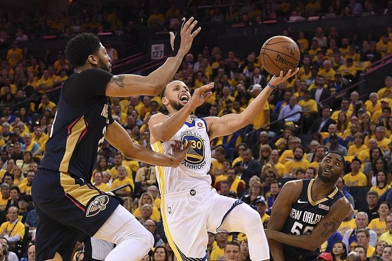 New Orleans' Anthony Davis (above left) and E'Twaun Moore trying to stop Golden State's Stephen Curry. Curry will be playing in his fourth straight Conference Finals after the Warriors won the semi-final series against the Pelicans 4-1.