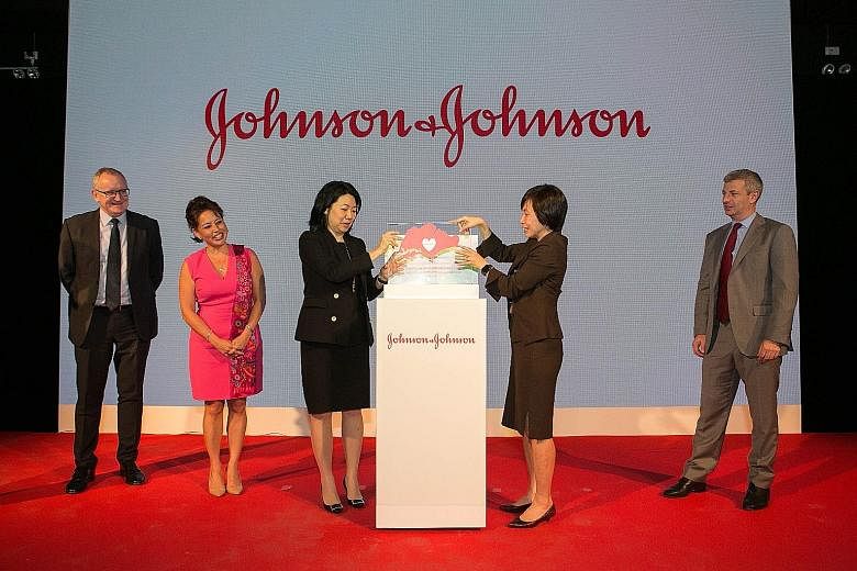 (From left) At the launch of Johnson & Johnson's new Asia-Pacific headquarters were Mr Pat Smallcombe, president, One J&J Southeast Asia; Ms Stephanie Syptak-Ramnath, charge d'affaires, US Embassy; Ms Ong Ai Hua, company group chair, Janssen, Pharmac