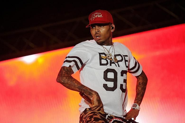A woman, who says she was raped in Chris Brown's home, is suing the R&B singer.