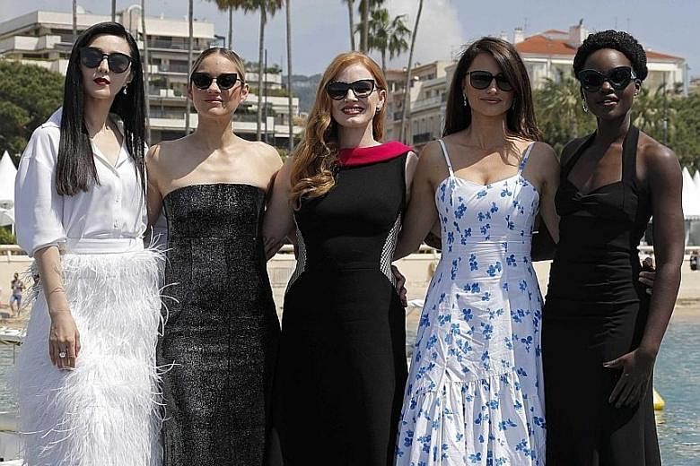(From left) Fan Bingbing, Marion Cotillard, Jessica Chastain, Penelope Cruz and Lupita Nyong'o pose on a pier. Jury president Cate Blanchett (above) arrives for the screening of Cold War at the 71st annual Cannes Film Festival. Indian actress Deepika