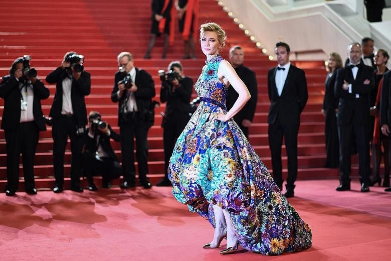 (From left) Fan Bingbing, Marion Cotillard, Jessica Chastain, Penelope Cruz and Lupita Nyong'o pose on a pier. Jury president Cate Blanchett (above) arrives for the screening of Cold War at the 71st annual Cannes Film Festival. Indian actress Deepika