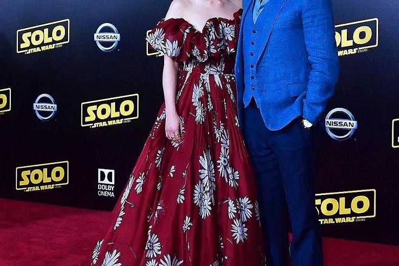 Solo: A Star Wars Story stars Emilia Clarke and Alden Ehrenreich at the world premiere of the movie in Hollywood on Thursday. Donald Glover (right), who stars as Lando Calrissian in Solo: A Star Wars Story, and fellow cast member Thandie Newton (far 
