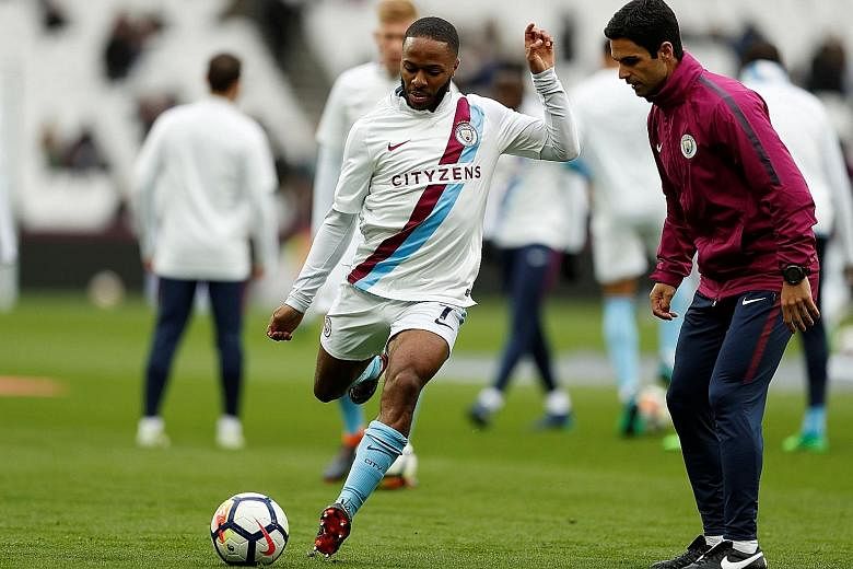 Manchester City are eager to offer Raheem Sterling (right, with co-assistant coach Mikel Arteta) a new long-term contract after his most successful season, in which he has scored 23 goals in all competitions.