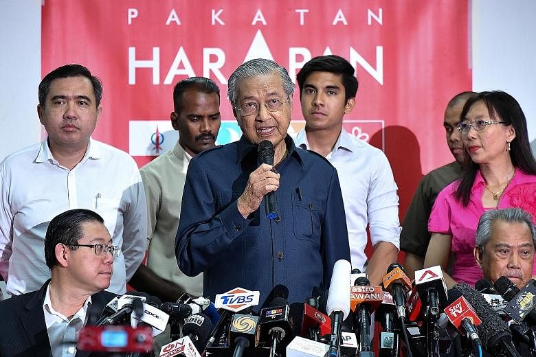 Mr Mohamad Sabu, president of Parti Amanah Negara, was named Malaysia's Defence Minister yesterday. Prime Minister Mahathir Mohamad at a news conference in Petaling Jaya yesterday with Pakatan Harapan elected officials and leaders, including (seated,