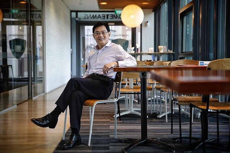 Finance Minister Heng Swee Keat in a cafe at Our Tampines Hub, Singapore's first integrated community and lifestyle destination. The Hub tapped residents' views to re-imagine how space can be used, with facilities grouped together to make them more c