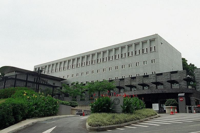 Top: The North Korean Embassy at High Street Centre, where its ambassador and three other embassy staff operate out of a suite of rooms. Above: The sprawling, high-security US Embassy in Napier Road, built at an estimated cost of US$30 million.