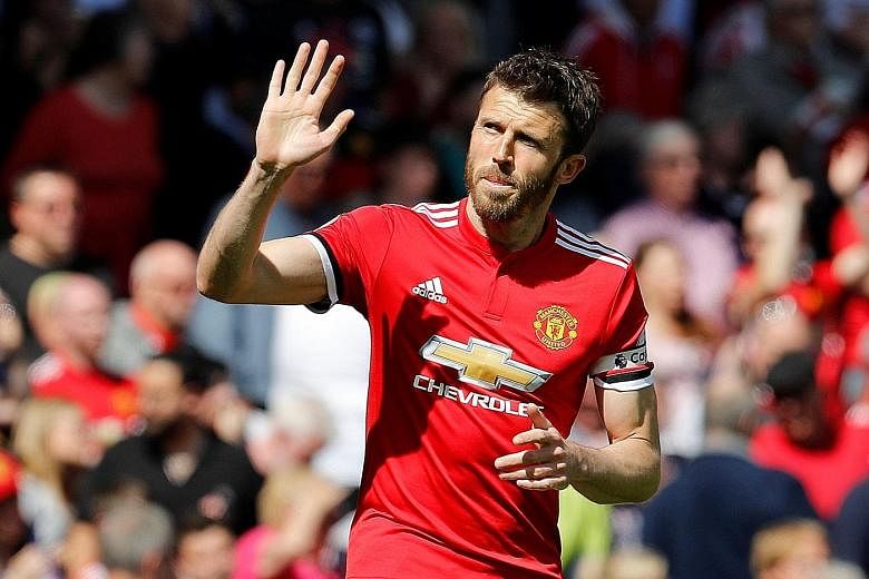 Michael Carrick wearing the captain's armband for the last time yesterday against Watford. His 12 years with the club brought 18 trophies, including five Premier League titles and the Champions League in 2008.