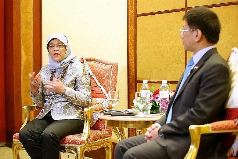 President Halimah Yacob with Singapore's High Commissioner to Brunei, Mr Lim Hong Huai, as she spoke to Singapore reporters at the end of her four-day state visit to Brunei yesterday. On Sunday, Mr Lim hosted a dinner reception for Singaporeans in th