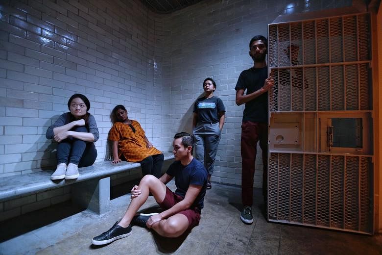Festival commissions included 0600 (above, in a rehearsal) by Singapore arts collective Ground Z-0, which took ticketholders through the stories of prisoners and government officials at the former Supreme Court. 
