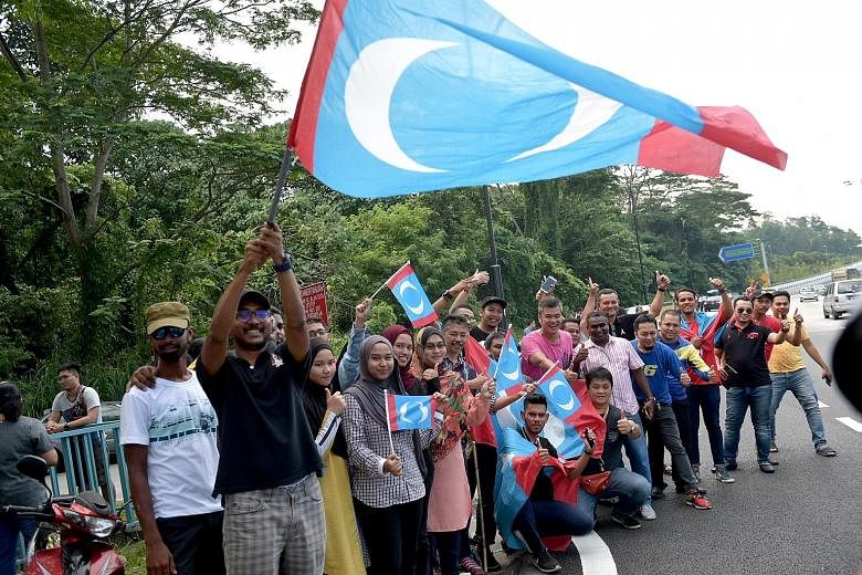 Pakatan Harapan supporters outside Istana Negara last Thursday, when Tun Dr Mahathir Mohamad was being sworn in as Prime Minister.