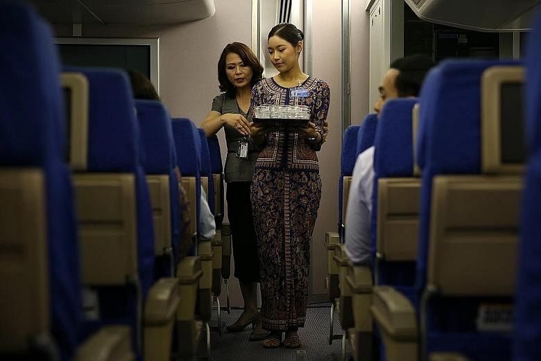 A Singapore Airlines cabin crew trainee at a deportment and etiquette class. The carrier topped the Singapore list for three years from 2012 to 2014, which earned it a spot in recruitment agency Randstad's Hall of Fame.