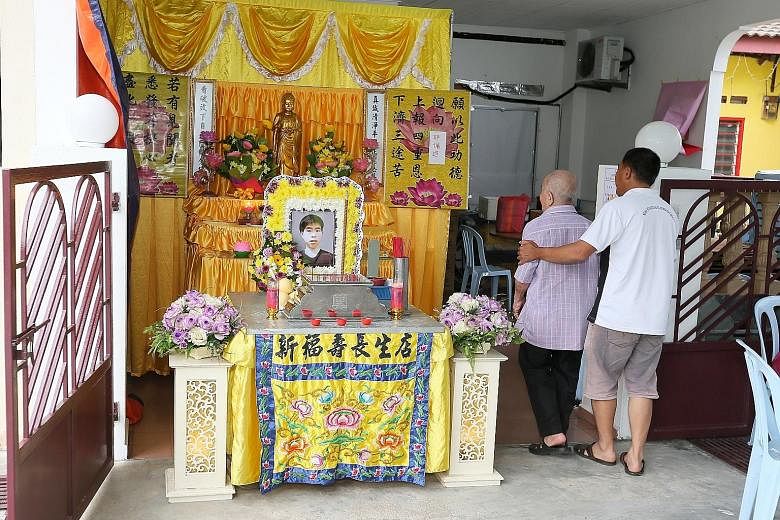 Corporal Kok Yuen Chin's wake in Melaka on Tuesday. The NSF was found unconscious in a station pump well after ragging activities.