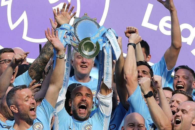 Pep Guardiola lifting the Premier League trophy after Manchester City became the first club in league history to amass 100 points. If he stays till 2021, he will spend longer managing City than he did with Barcelona or Bayern Munich.
