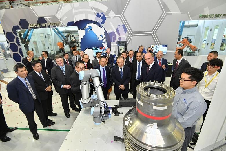 A demonstration of a smart assembly system at A*Star's Advanced Remanufacturing and Technology Centre last September, when A*Star teamed up with Rolls-Royce and Singapore Aero Engine Services to set up a lab to speed up the development of innovative 