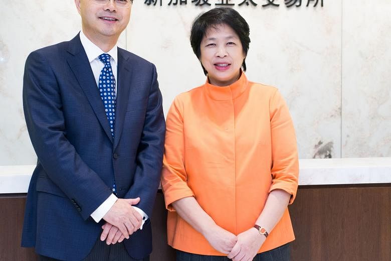 Asia Pacific Exchange founder and chief executive officer Eugene Zhu and its chairman, Mrs Lim Hwee Hua. Apex will offer palm olein futures that will be dollar-denominated and physically delivered.