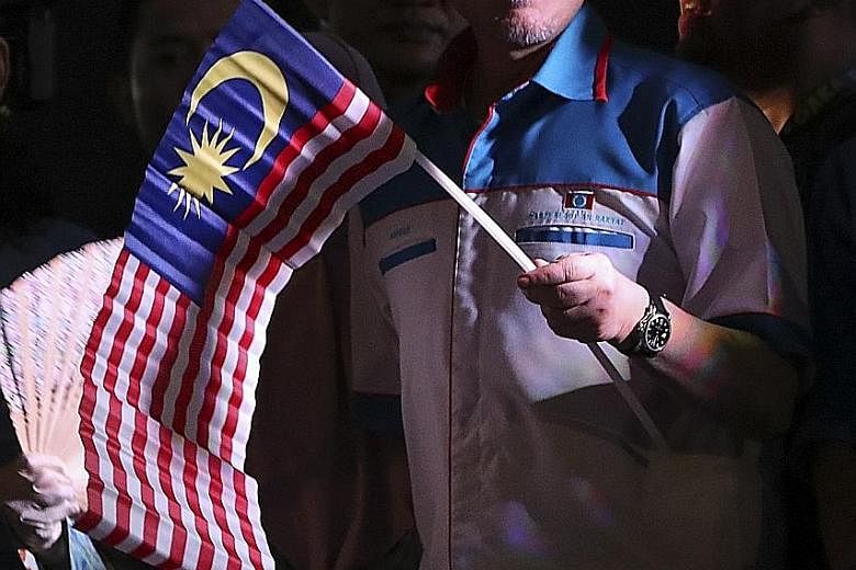 Mr Anwar Ibrahim at a celebration following his release from prison in Petaling Jaya late on Wednesday. He has gone to great lengths in recent days to lend his support to the new Mahathir-led government, insisting that he is in no hurry to take over.