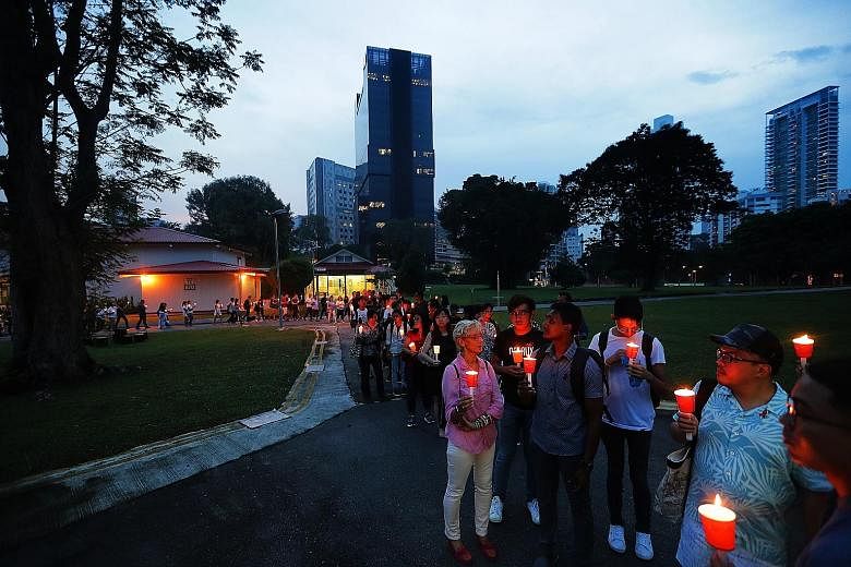 About 100 people, including those with HIV, their friends, families and healthcare workers, gathered to light candles and silently walk the grounds of the Communicable Diseases Centre for the last time yesterday.