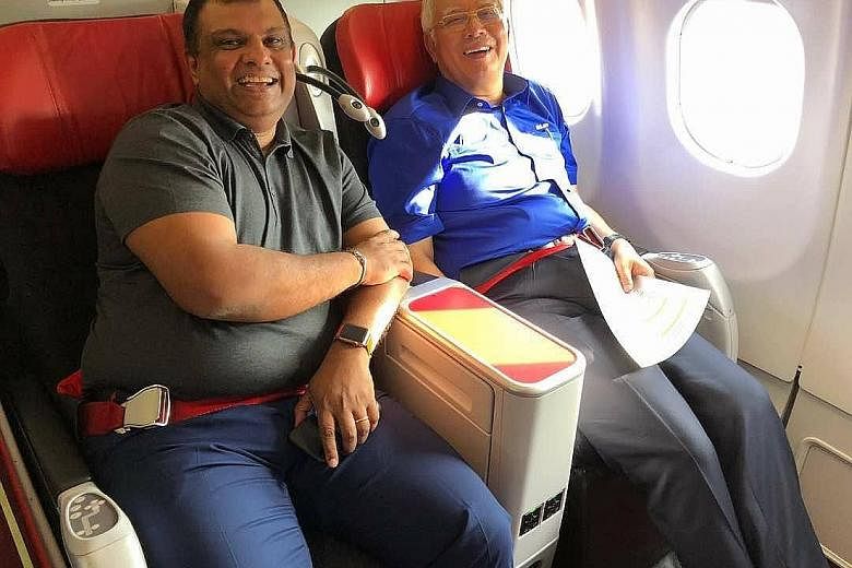 AirAsia boss Tony Fernandes with former premier Najib Razak, who was ferried from Kota Kinabalu to Kuala Lumpur on a Barisan Nasional-themed aircraft.