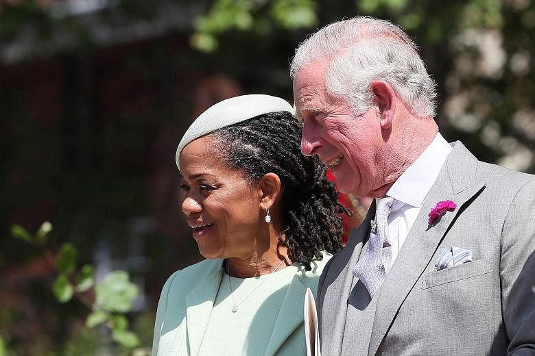 Ms Doria Ragland, Prince Charles and his wife Camilla, Prince William and his wife Catherine and their children, Prince George and Princess Charlotte, leaving the chapel after the wedding. The Duchess of Cambridge (in white) and other guests arriving