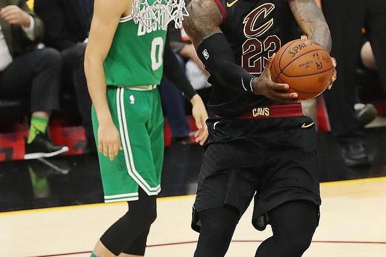 Cleveland Cavaliers star LeBron James on his way to a dunk in the 116-86 win over the Boston Celtics on Saturday.